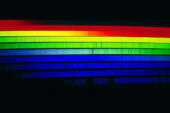 The solar spectrum in the visible, or white light, region. Spectrograms like this split the light up into many wavelengths (colors). Called absorption lines because they are created as atoms absorb light at certain wavelengths, the dark bands indicate specific ionized elements in the Sun.