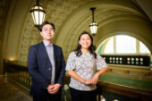Charee Thompson and Junhyung Han standing in a campus building.