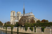 Photo of a southeast view of Notre-Dame Cathedral in Paris, with the water of the Seine River in the foreground.