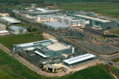 This image shows an overhead shot of a large semiconductor plant located in a rural area.