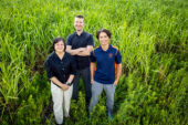 The researchers stand in a field at the U. of I. Energy Farm.
