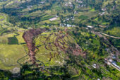 An overhead view of a large landslide showing a detachment and numerous land fractures