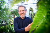 James Dalling in the plant conservatory on the U. of I. campus