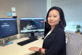 Photo of Fang Fang sitting at her desk