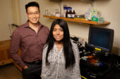 Professor Jefferson Chan stands on the left, graduate student Melissa Lucero stands on the right.