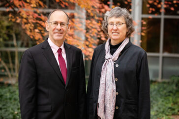 Sheldon Jacobson and Janet Jokela stand outdoors.