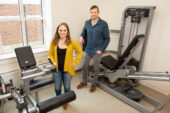 Photo of researchers standing in an exercise laboratory.