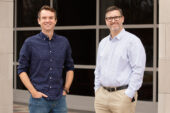 Graduate student and lead author Kyle Bennett standing outdoors with social work professor and lead app developer Douglas C. Smith