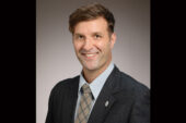 Portrait of Jon Hale dressed in a suit and tie