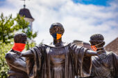 The Alma Mater statue wears a mask, as do Labor and Learning behind her.