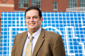 Photo of Kashif Ahmad standing outside the Carle Illinois College of Medicine