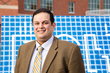 Photo of Kashif Ahmad standing outside the Carle Illinois College of Medicine
