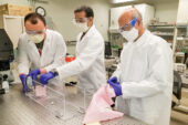 Mechanical science and engineering professor Taher Saif, right, and students Onur Aydin, left, and Bashar Emon test common household fabrics used to make face masks to help stop the spread of the coronavirus.