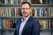 Sociologist Brian Dill teaches an introductory course on poverty in which he deals with the subject in both the U.S. and globally.