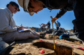 Field archaeologists Marie Meizis and Doug Jackson work together to record their data.
