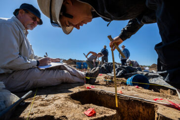 Field archaeologists Marie Meizis and Doug Jackson work together to record their data.