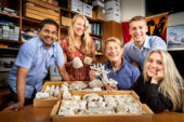 Using newly developed geological techniques, researchers, from left, microscopy expert Mayandi Sivaguru, Kaitlin Fouke, geologist and microbiologist Bruce Fouke, Kyle Fouke, Lauren Todorov and their colleagues made discoveries about the formational history of Porites coral skeletons to fine-tune the records used to make global climate predictions.