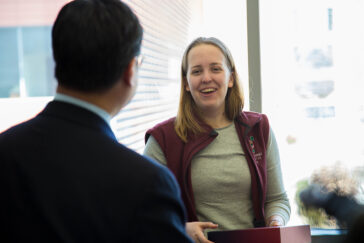 King Li, dean of the Carle Illinois College of Medicine, surprised Elizabeth Woodburn, then a bioengineering student at Illlinois, with her acceptance package.
