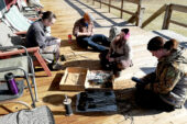 The crew spends an afternoon preparing GPS transmitters with cords that will be tied to turkeys.