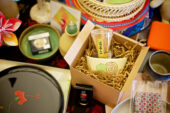 A collection of cups, saucers, pots, books and other items from Japan