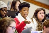 Students in U.S. Congress class, each in the role of a House member, debate a bill during a floor session.