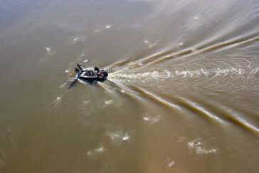 Researchers from the Illinois Natural History Survey have surveyed fish in the Illinois River since 1957. Here, the team uses electricity to stun the fish for capture.