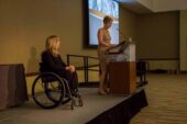 Jean Driscoll in a wheelchair on a stage