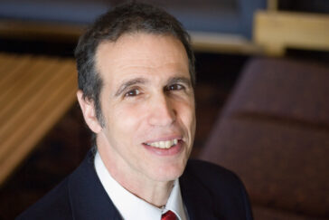Rob Olshansky is a professor and the associate head of the department of urban and regional planning.