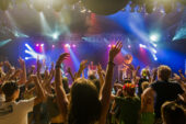 Red Barat, a band, performs before dancing spectators