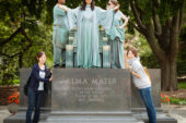 Students have already started "sitting in" for Alma and posting pictures to the Web. Junior Katie Chan, as Alma, is flanked by senior Arpan Roy, as Labor, on the left, and sophomore Clare Curtin, Learning, on the right. Lisa Ogawa, left, and Azusa Terauchi pose next to the living sculpture.