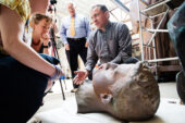 Head games Andrzej Dajnowski, the lead conservator with Conservation of Sculpture and Objects Studio, Forest Park, Ill., explains the disassembly process to a team from the U. of I. that is following the status of the work. Further work has shown that the Alma Mater statue actually comprises 48 pieces and was kept together with nearly 1,000 bolts and fasteners. The repaired statue is expected to return to campus in time for commencement 2014.  Click photo to enlarge
