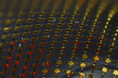 Stretchable micro-LED display, consisting of an interconnected mesh of printed micro LEDs bonded to a rubber substrate.