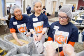 Feeding the hungry Volunteers packaged more than 81,000 meals for the Eastern Illinois Foodbank on April 20 as part of the Day of Service, which sought to encourage people to volunteer as well as provide meals for the hungry in our community. Among those volunteering for the food packaging project were (from left) Lesley Lee, a U. of I. library specialist; her daughter, Jenna Purnell, age 7; and Parkland College student Pamela Roper.  Click photo to enlarge