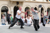 Impromptu collaboration A boy from the audience spontaneously joins Philip Johnston in a dance at the Corn Market in Belfast, Ireland.  Click photo to enlarge