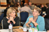 At left, Mary Ellen O'Shaughnessey, executive assistant dean for the College of Fine and Applied Arts, listens while Sandra Goss Lucas, a professor of psychology, makes a point during roundtable discussions at the "Summit on Online Education: The Present and Future" on Oct. 31. The discussions were designed to identify barriers to improved online education integration and to offer localized solutions.  Click photo to enlarge