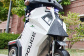 UI Police Officer James Carter demonstrates one of the new Sentinel transportation devices, which the department started using on the Urbana campus for the first time this fall. UIPD officers are using two Sentinels for basic patrol and crowd-control work, while students will be using them for the Safewalks program.