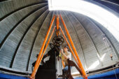 Yousef Ahessi, a sophomore engineering student at Swarthmore College, secures a portion of the U. of I. Observatory's 117-year-old telescope before it is lifted out by crane and sent to Ray Museum Studios in Pennsylvania. The telescope will undergo maintenance and renovation. It is expected to be back on campus this fall.