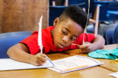 Uncommon flair Jonathan Davis, age 10, and other campers tried a variety of writing implements, including rocks, quill pens, pencils and fountain pens.  Click photo to enlarge