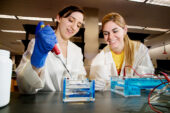 Sophomores in bioengineering Maggie Barbero, left, and Rachel Walker, both members of the World Champion iGEM team, at work in a laboratory in the Institute for Genomic Biology. Their team was the lone undergraduate winner at the international competititon.