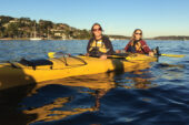 Juniors in education Rachel Granzin (left) and Lindsay Duffy go kayaking near Sydney during a study-abroad trip to Australia.