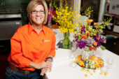 Tammie Lawson, a UI floral designer for 12 years, has been arranging flowers for most of her adult life. She works for University Catering as well as contracted events such as weddings. After one use, most flowers are kept in storage and reused for other campus events. Lawson said she is constantly on the lookout for new and better floral varieties  preferably in orange and blue.  Click photo to enlarge