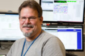Reptile friendly Mike Pingleton, a computer operations manager for the National Center for Supercomputing Applications, uses his off-time for more down-to-earth pursuits - his interest in reptiles and amphibians. The amateur herpetologist has spent countless hours studying frogs, snakes and other such animals. He's volunteered for herpetology-centric research projects, written a book on red-foot tortoises and is finalizing a children's book about "cool snakes."  Click photo to enlarge