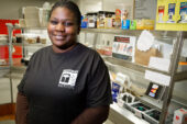 Tamika Dorris, a snack bar attendant at the Beckman Institute Caf for four years, likes the variety of her job and goes out of her way to provide a kind word to each customer. Over the summer, the Dorris family will provide sweat equity at their new house, the 65th home constructed by Habitat for Humanity of Champaign County.  Click photo to enlarge