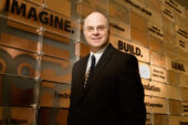 Todd Hearn, a graphic design manager for Facilities and Services, has for the last 15 years been involved in some high-profile projects on campus. The ever-changing job means Hearn must keep current on software and construction processes. Hearn is standing in front of the donor wall that he helped design inside the new Electrical and Computer Engineering building.  Click photo to enlarge