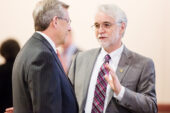 Marching on Though U. of I. President Bob Easter will retire at the end of the semester, his replacement, Timothy R. Killeen, right, has spent the last several months speaking with campus groups and making transition plans, and he was involved in the recommendation for the Urbana medical school. Killeen speaks here with Edward L. McMillan, the new chairman of the U. of I. Board of Trustees, at the board's March 12 meeting in Urbana.  Click photo to enlarge