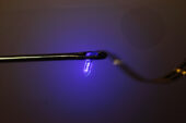 A thin plastic ribbon printed with advanced electronics is threaded through the eye of an ordinary sewing needle. The device, containing LEDs, electrodes and sensors, can be injected into the brain or other organs.