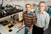 A study led by University of Illinois plant biology professor Feng Sheng Hu (right), with graduate student Michael Urban, used a spooling-wire micro-combustion device (pictured) coupled with an isotope mass spectrometer to analyze individual grains of grass pollen to determine the age of C4 grasses. The study pushed back the origin of C4 plants by millions of years.
