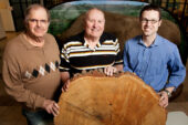 William McClain, left, a botanist with the Illinois State Museum, with botanist John Ebinger and ecologist Greg Spyreas, both of the Illinois Natural History Survey at the University of Illinois, looked to tree scars for physical evidence of fires over a period of 226 years in southern Illinois.