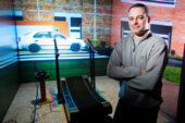 Postdoctoral researcher and study co-author Mark Neider in the lab with the multidirectional treadmill and simulated street scene used in the multi-tasking study.