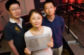 A team of Illinois researchers led by Nicholas X. Fang, left, a professor of mechanical science and engineering, has created the world's first acoustic "superlens." Doctoral student Shu Zhang holding the lens and Leilei Yin, a microscopist at Beckman Institute, were co-authors.
